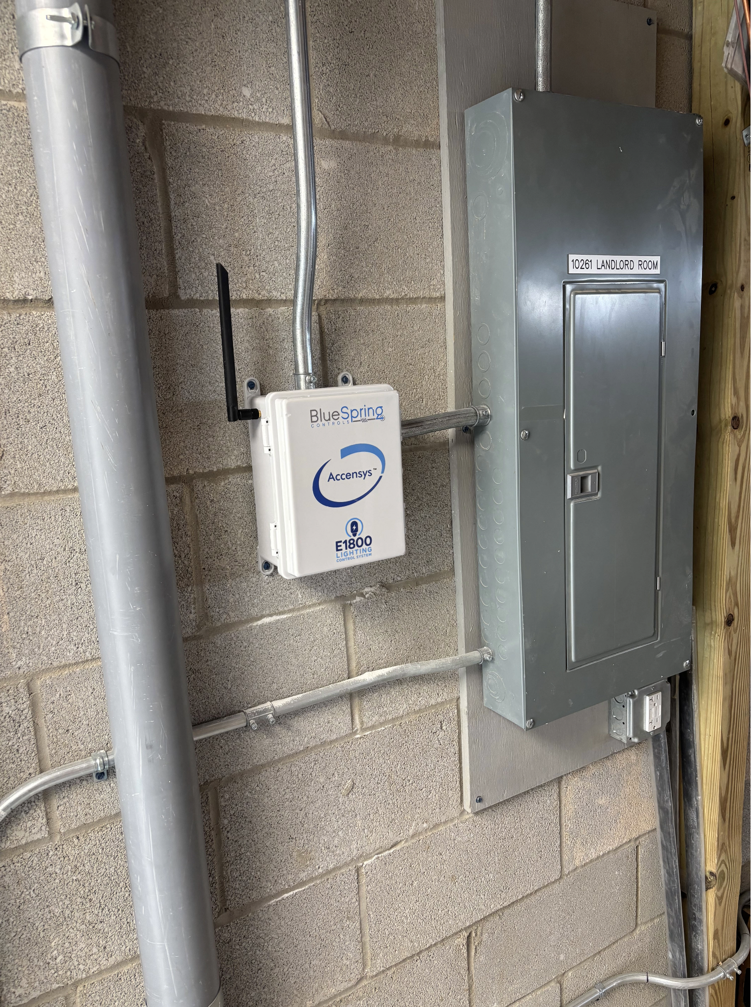 E1800 Lighting Control System installed beside a commercial electrical panel