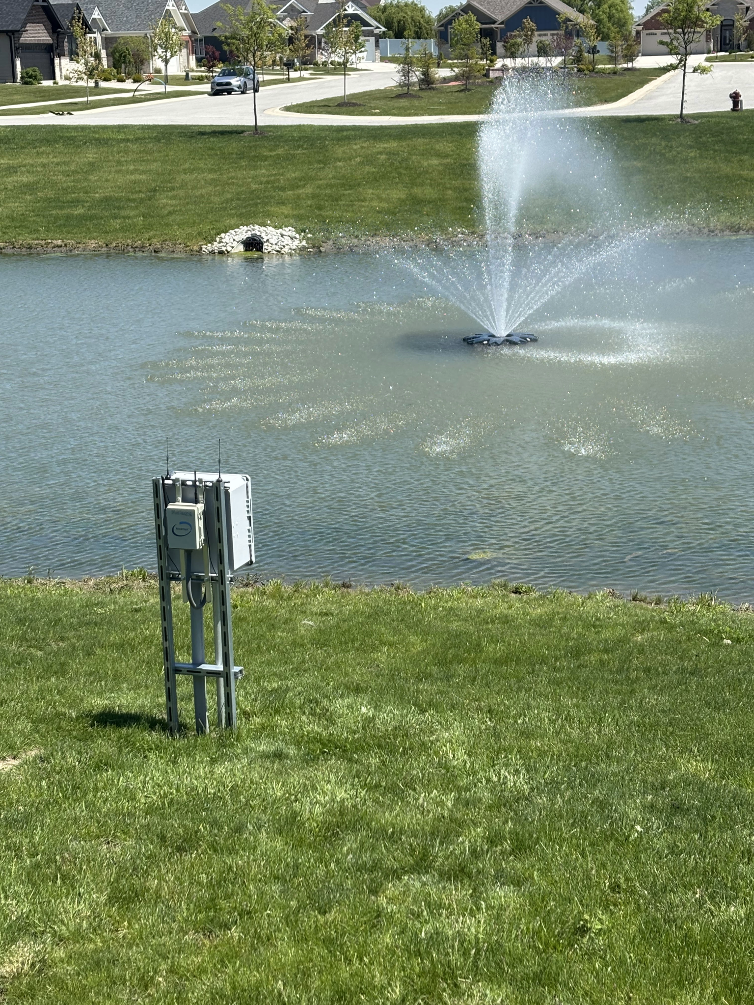 BlueSpring fountain controller installed beside an operating neighborhood fountain